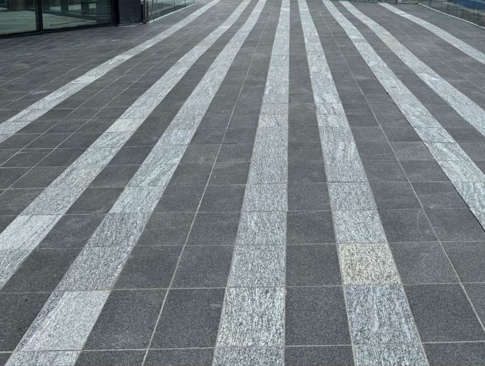 Outdoor paving and tile installation in Vancouver showing patio, walkway, and pool deck weatherproofing